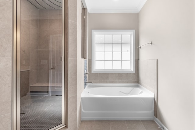 bathroom featuring tile patterned flooring, crown molding, and independent shower and bath