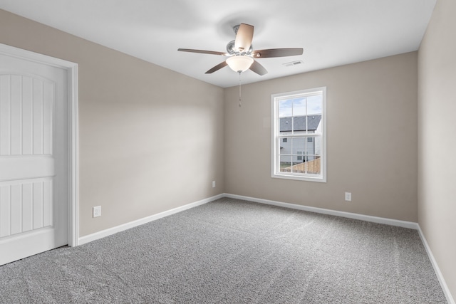 carpeted empty room with ceiling fan