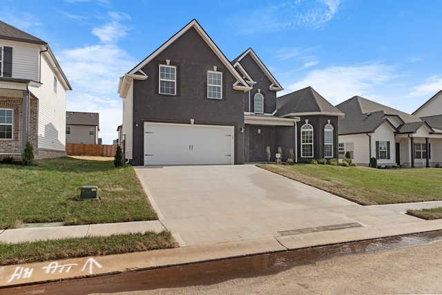 view of front property with a front yard and a garage