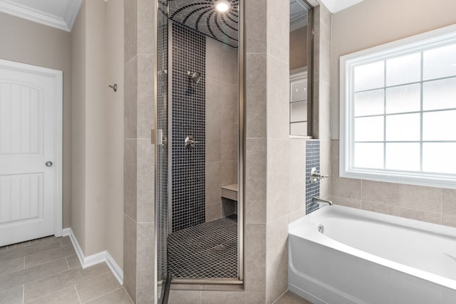 bathroom featuring plus walk in shower, tile patterned flooring, a wealth of natural light, and crown molding