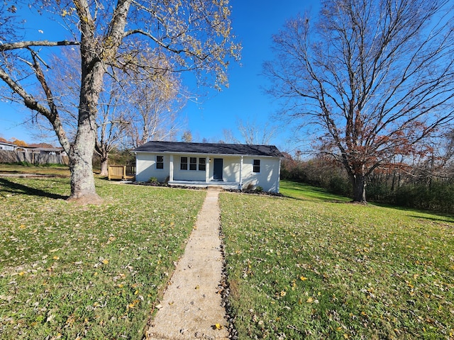 ranch-style home featuring a front yard