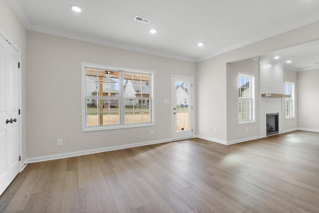 650 Woodrush Dr, Clarksville, TN 37040 - unfurnished living room featuring wood finished floors, crown molding, a fireplace, and recessed lighting