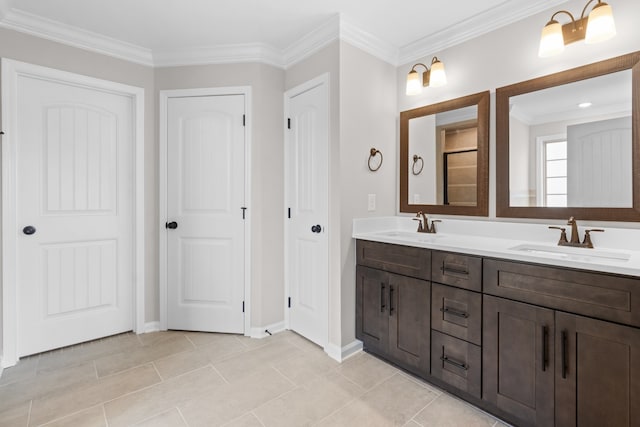 bathroom featuring vanity, tile patterned floors, and crown molding