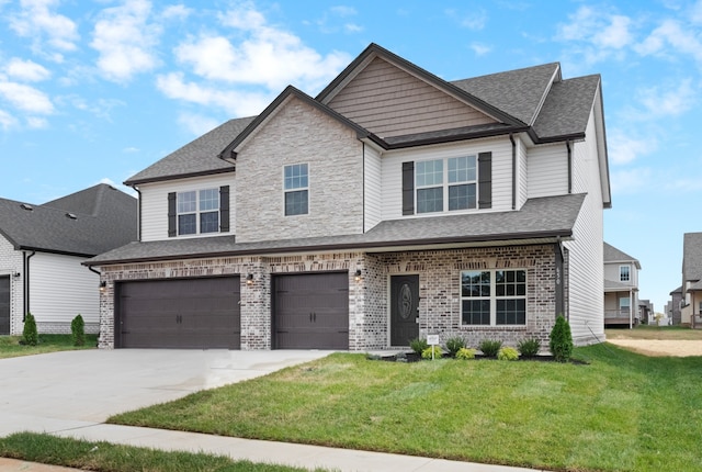 craftsman-style house featuring a garage and a front lawn