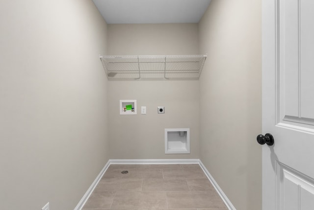 laundry area featuring washer hookup, electric dryer hookup, and light tile patterned floors