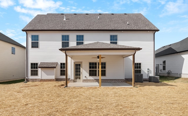 back of house featuring central air condition unit, a patio area, ceiling fan, and a lawn