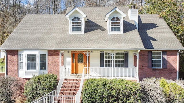 3467 New Hope Rd, Hendersonville, TN 37075 - cape cod house with brick siding, covered porch, roof with shingles, a chimney, and stairs