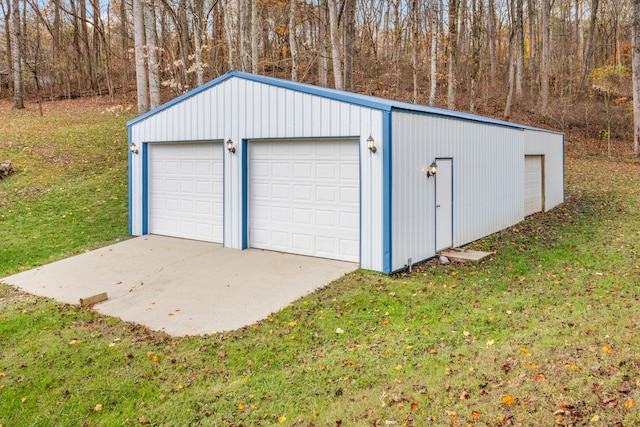 garage featuring a lawn