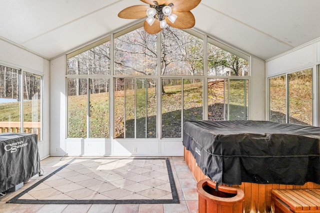 sunroom / solarium featuring ceiling fan and lofted ceiling