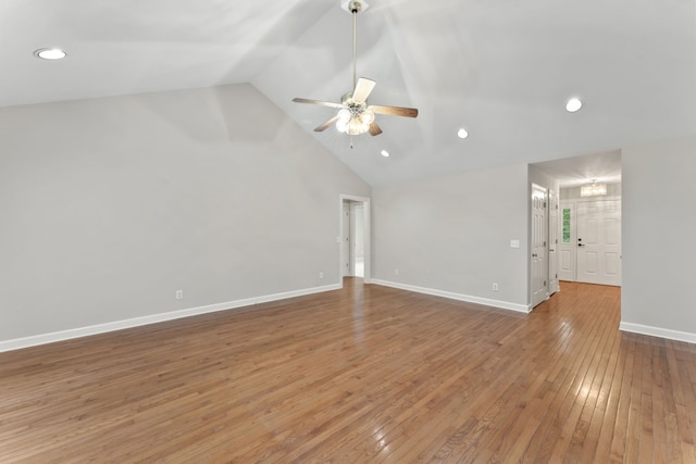 interior space with wood-type flooring, ceiling fan, and lofted ceiling