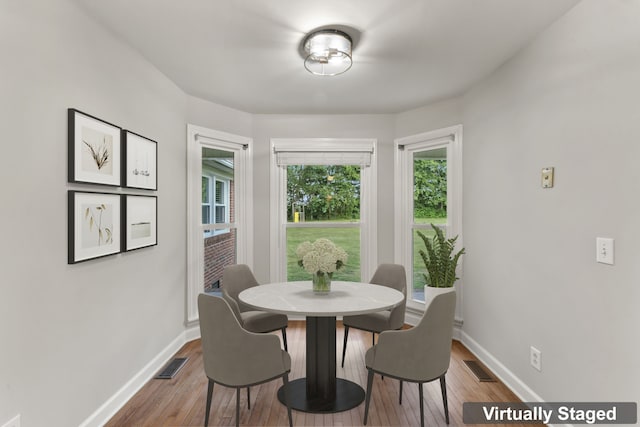 dining area featuring hardwood / wood-style floors