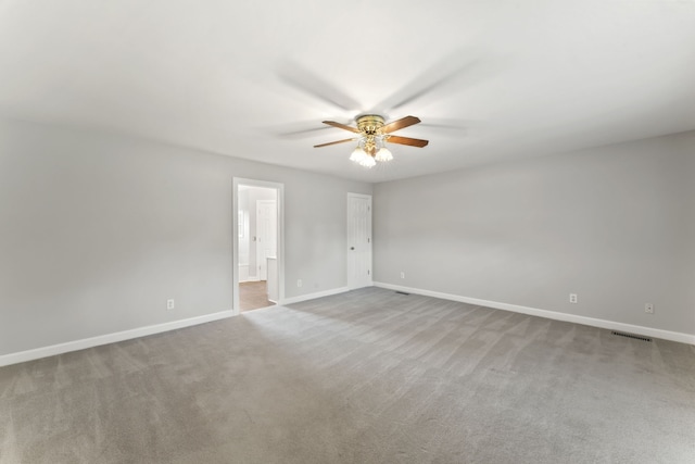 unfurnished room featuring light carpet and ceiling fan