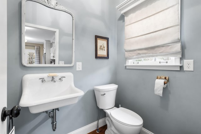 bathroom featuring sink and toilet