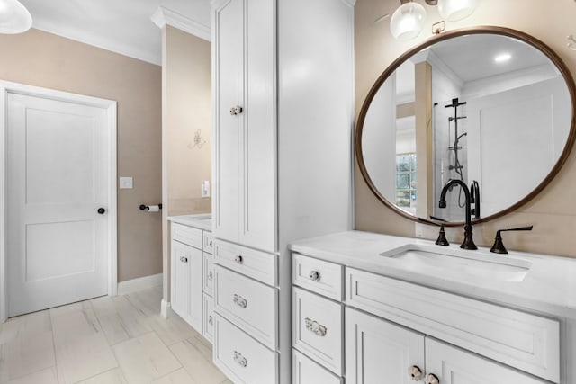 bathroom with vanity and crown molding