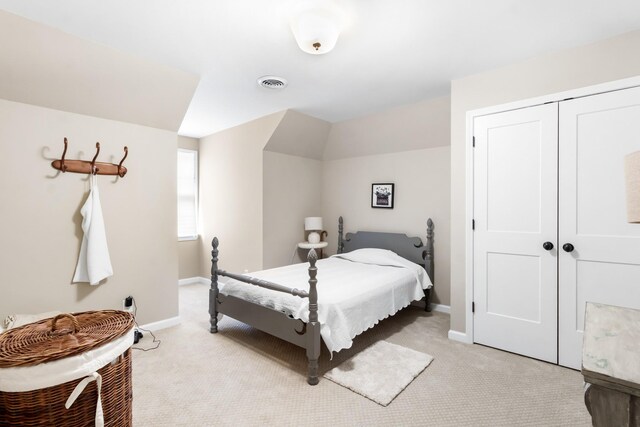 carpeted bedroom featuring a closet