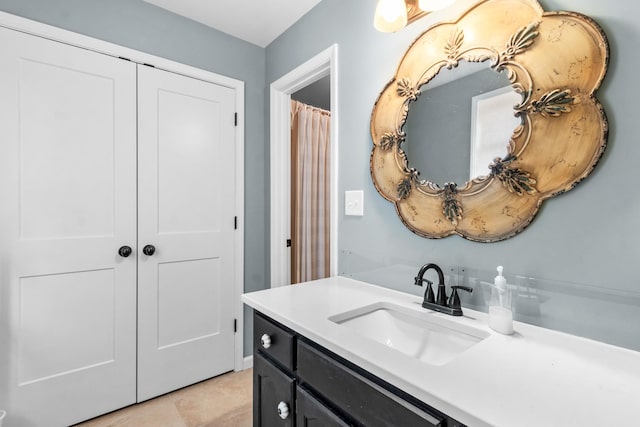 bathroom featuring tile patterned floors and vanity