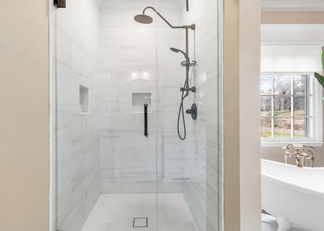 bathroom with a shower with door