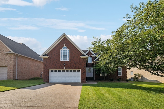 view of front property featuring a front lawn and a garage