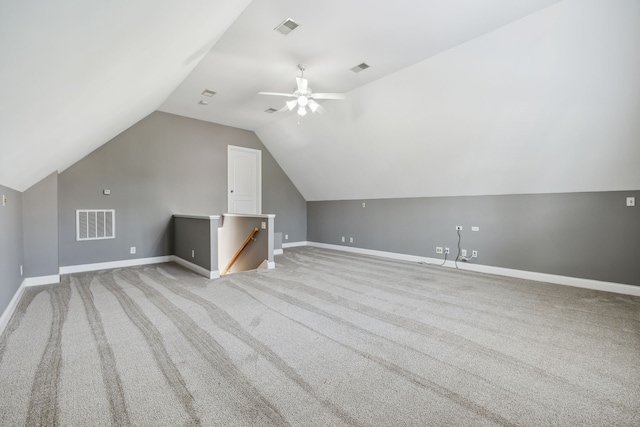 additional living space featuring light carpet, vaulted ceiling, and ceiling fan