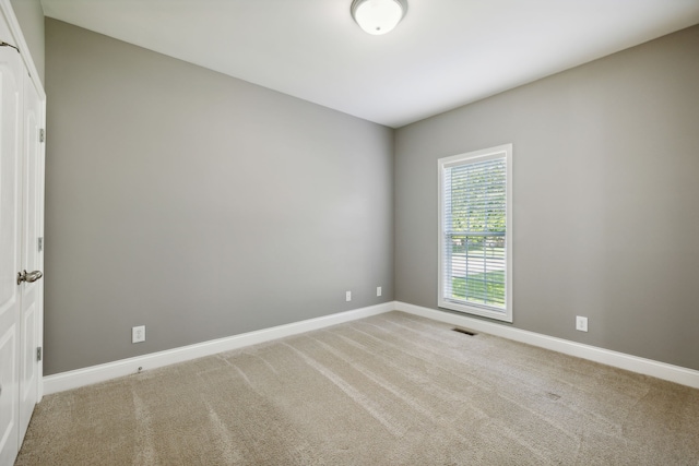 unfurnished room with carpet flooring