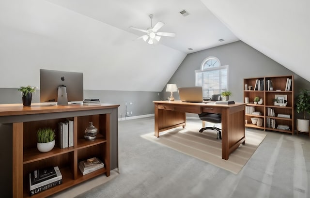 carpeted office with vaulted ceiling and ceiling fan