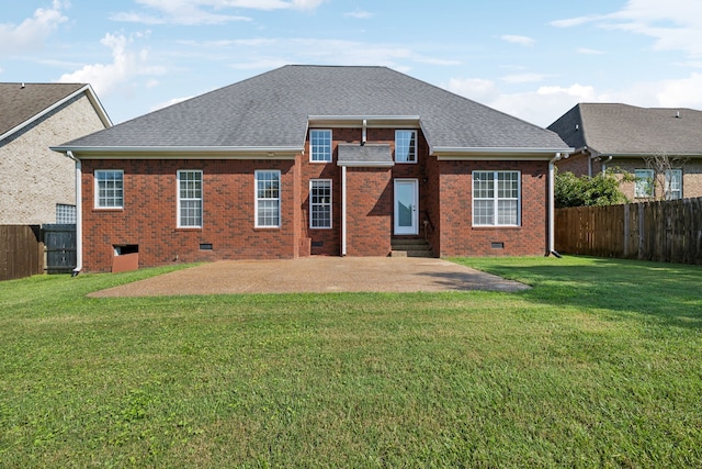 back of property featuring a lawn and a patio area