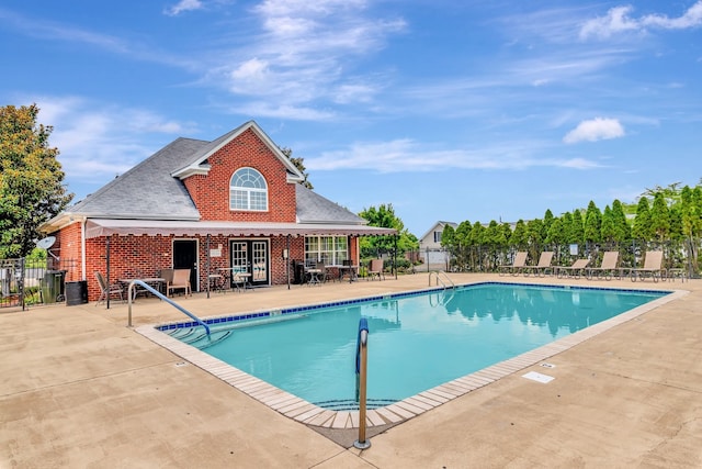 view of swimming pool with a patio area