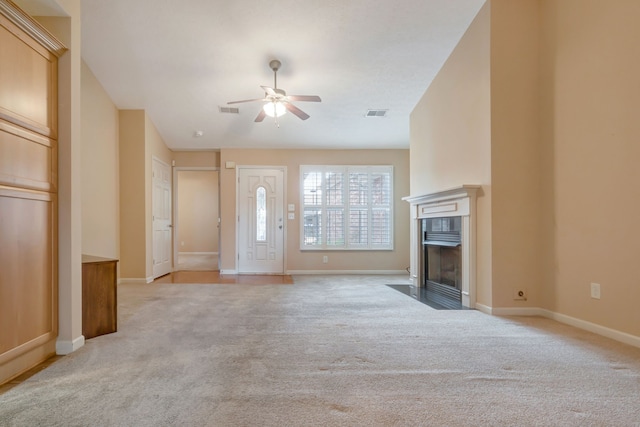 unfurnished living room with light carpet and ceiling fan