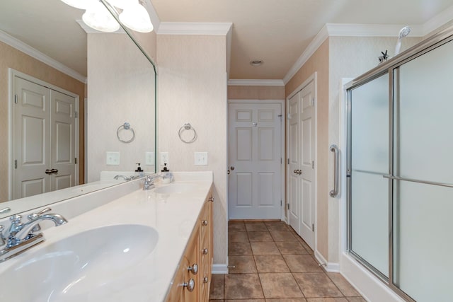 bathroom featuring tile patterned flooring, vanity, ornamental molding, and a shower with door