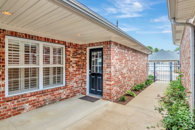 property entrance featuring a patio