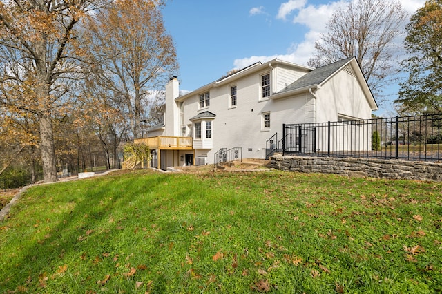 back of house featuring a lawn