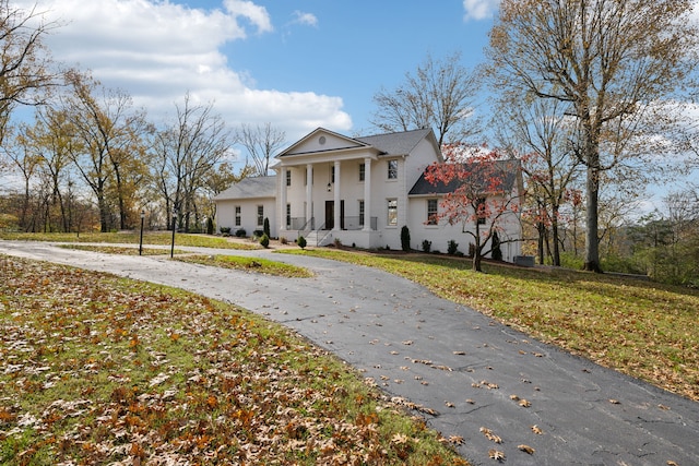 greek revival house with a front yard