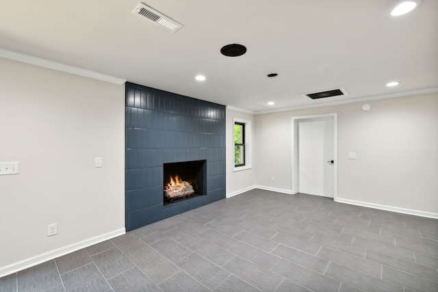 unfurnished living room with a large fireplace and ornamental molding