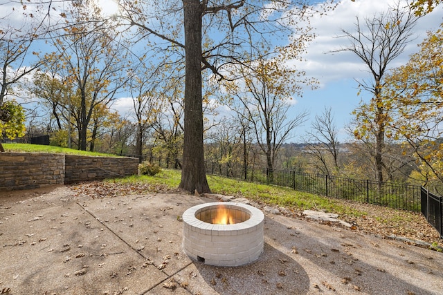 view of patio with a fire pit