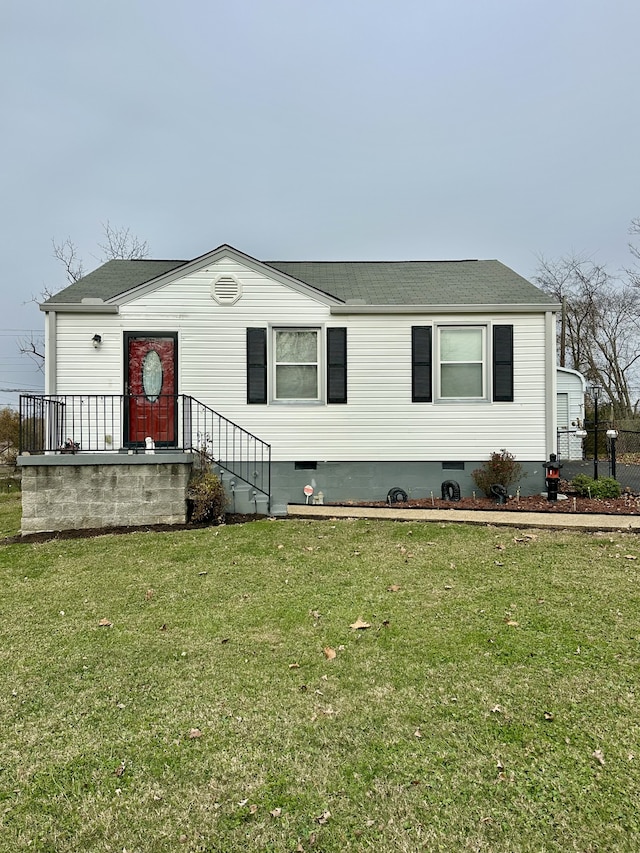 view of front of home with a front lawn