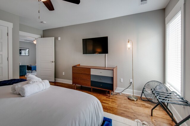 bedroom featuring hardwood / wood-style floors and ceiling fan