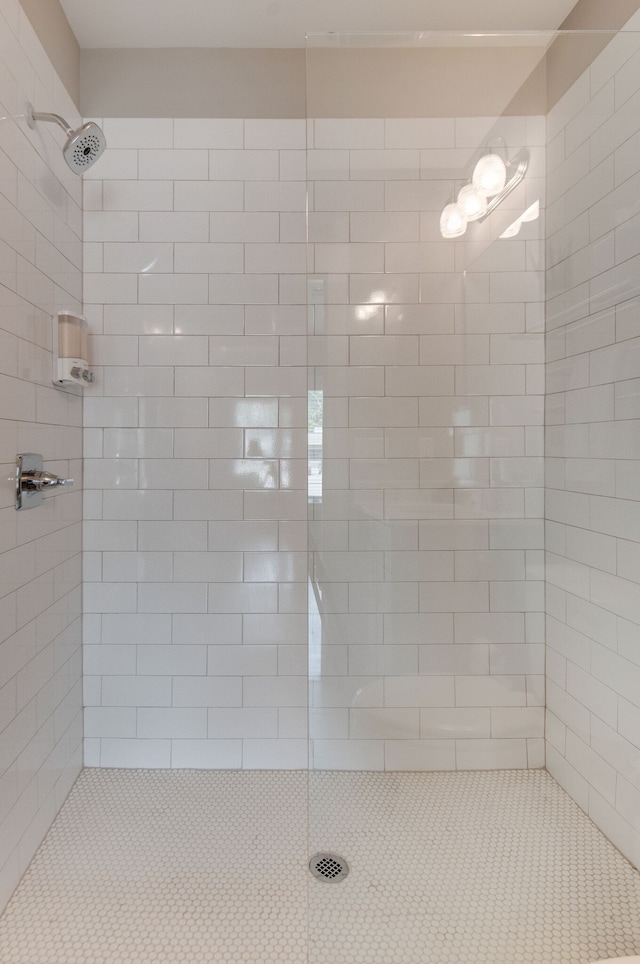 bathroom with a tile shower