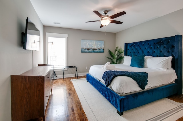 bedroom featuring ceiling fan and wood-type flooring