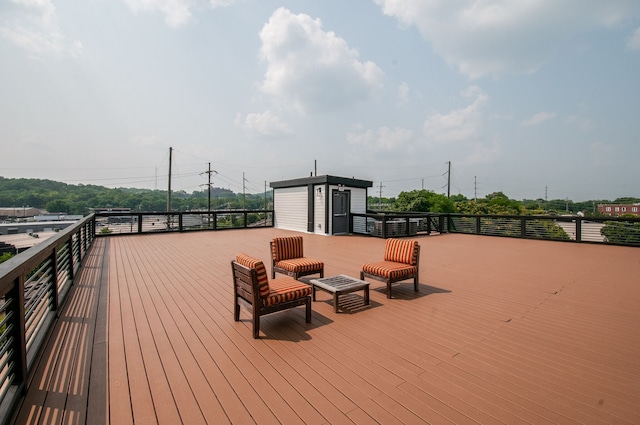 wooden deck featuring a shed