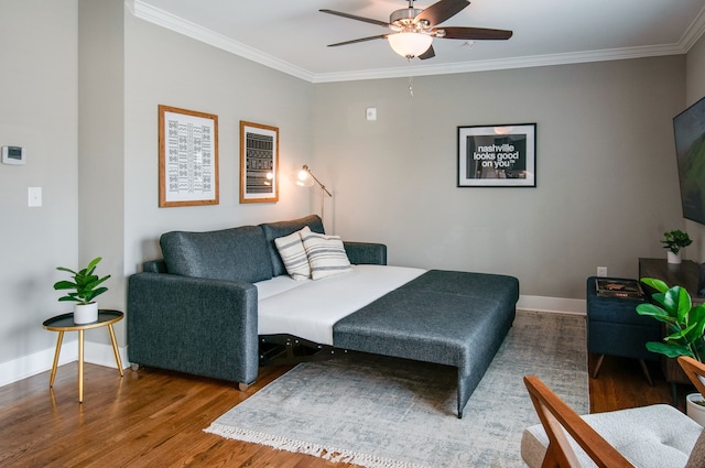 bedroom with hardwood / wood-style floors, ceiling fan, and ornamental molding