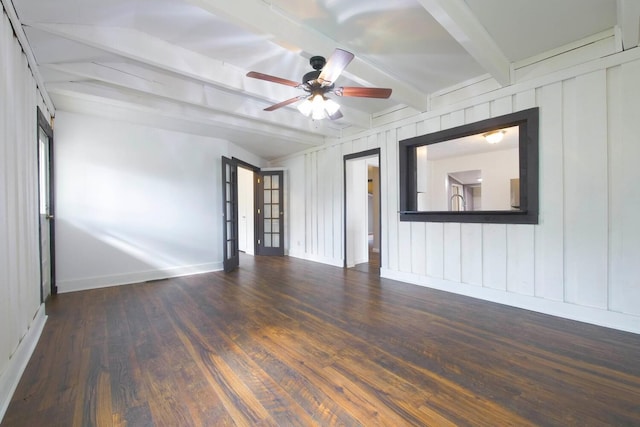 unfurnished room featuring ceiling fan, beam ceiling, dark wood-type flooring, and french doors