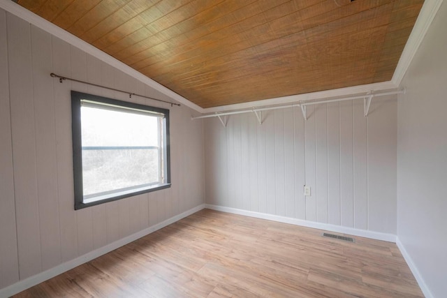 interior space with wooden walls, light hardwood / wood-style flooring, lofted ceiling, and wood ceiling