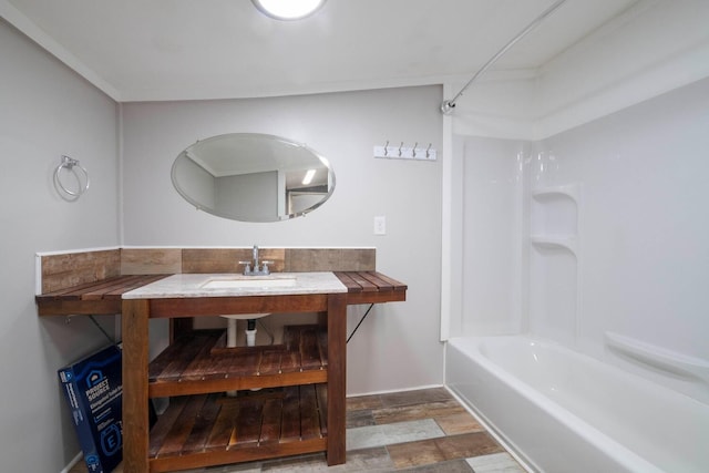 bathroom featuring sink and tub / shower combination