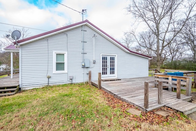 rear view of house featuring french doors and a wooden deck