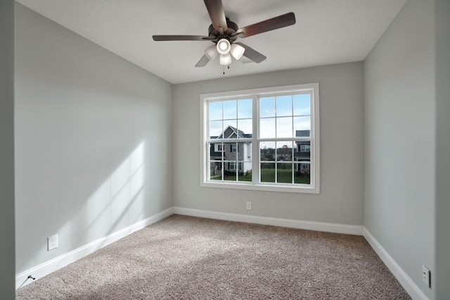 empty room featuring carpet and ceiling fan