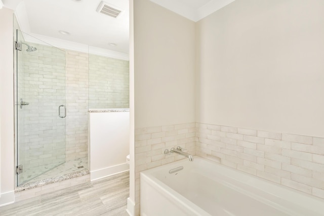 1311 Thomas Ave Unit 7, Chattanooga, TN 37409 - full bath with a bath, a stall shower, toilet, and wood finished floors