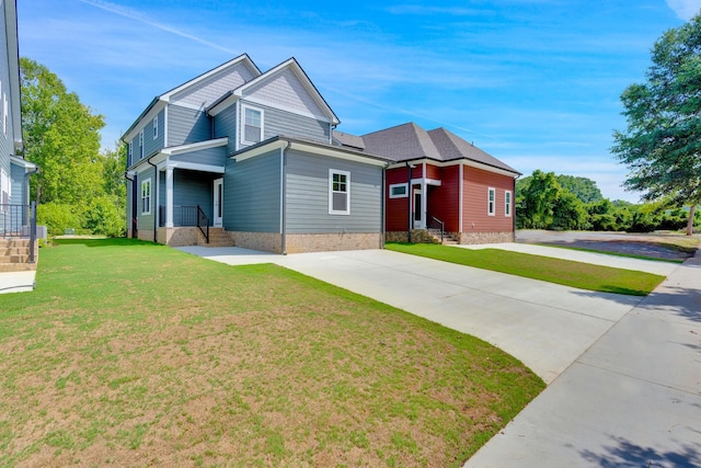 1311 Thomas Ave Unit 7, Chattanooga, TN 37409 - view of front of house featuring a front lawn and driveway