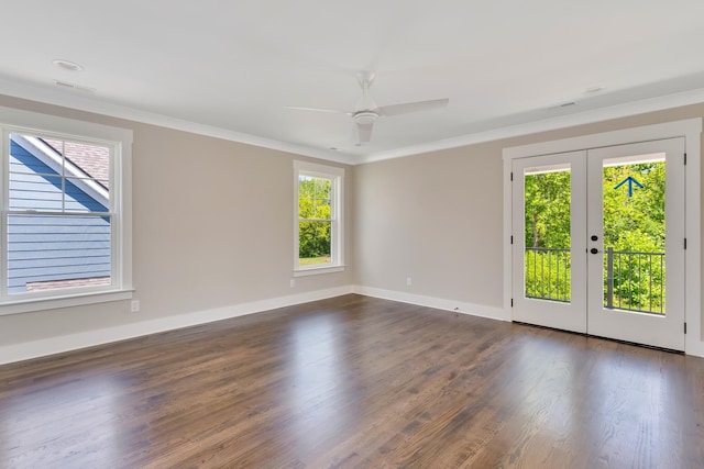 spare room featuring ornamental molding, french doors, baseboards, and dark wood-style floors