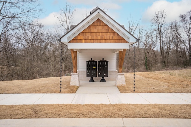 view of home's community featuring mail area