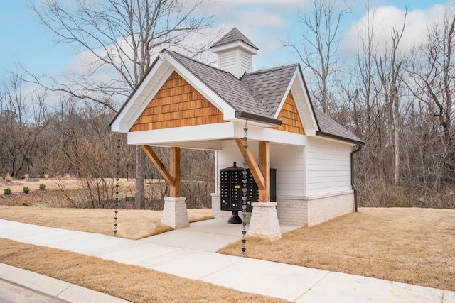 view of home's community featuring mail area